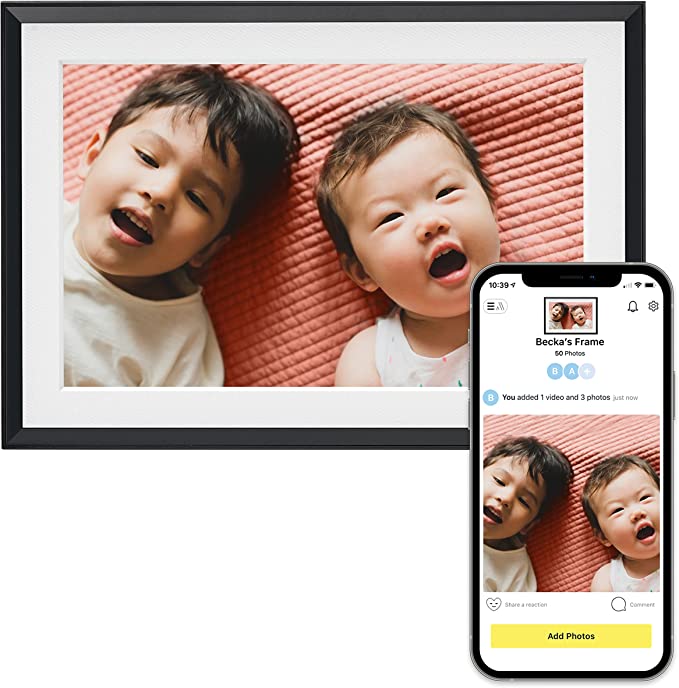 Advertisement of picture frame of a child and baby on red striped blanket